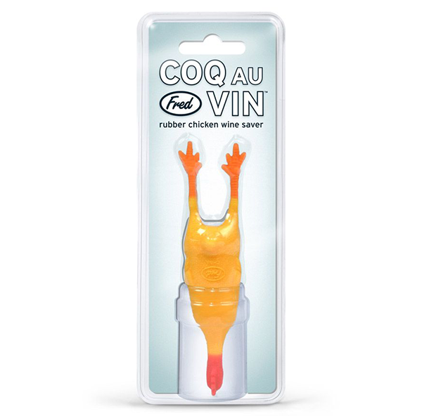 Rubber chicken wine stopper 'Coq au Vin' by Fred in packaging, featuring yellow silicone chicken body with raised wings and red feet, inserted into white wine bottle neck for humorous wine preservation