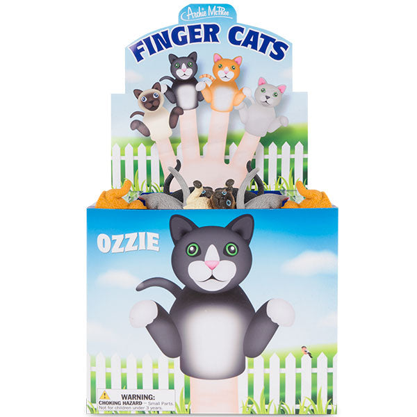 Colorful display box of Finger Cats puppet toys featuring cartoon cats on fingers above a white picket fence, with a large black and white cat named Ozzie on the front of the box. Various cat finger puppets visible inside the packaging.