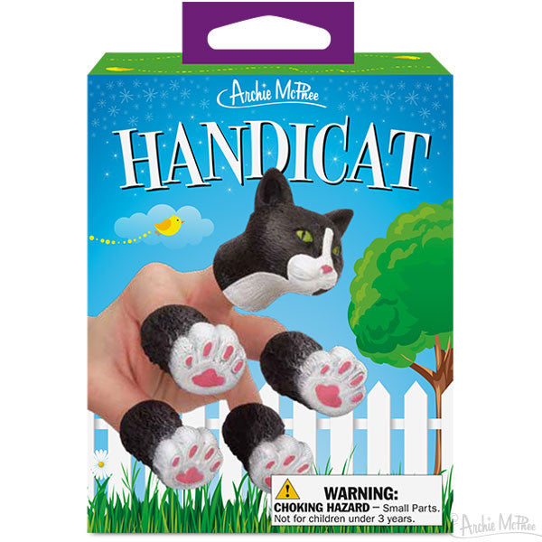 Handicat finger puppet set packaging with cat head and paw puppets displayed on a hand, colorful cartoon background featuring fence, tree, and bird