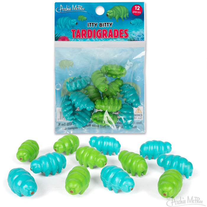 Colorful toy tardigrades in blue and green, packaged in a clear bag with underwater-themed label. Set of 12 small, soft vinyl figures representing microscopic water bears, each about 1 inch long.