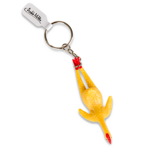 Yellow rubber chicken keyring with white tag, featuring a humorous design of a stretched-out chicken body and red accents, attached to a metal key ring for easy carrying and fun accessorizing