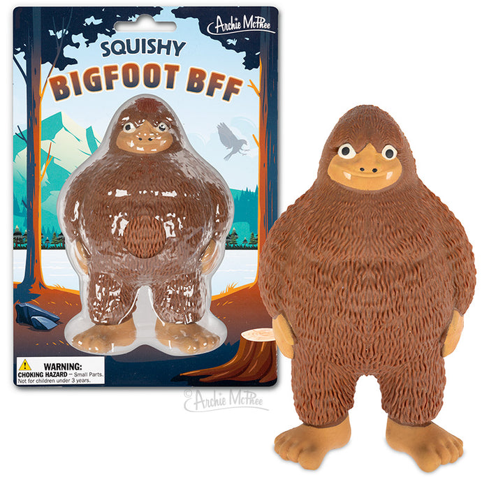 Squishy Bigfoot BFF toy in packaging and standalone, showing brown fuzzy creature with friendly smile and large feet, set against forest background with trees and birds