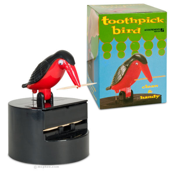 Toothpick Bird Dispenser with red and black plastic bird on black base, dispensing toothpick from beak. Green and blue product box displaying bird illustration and "toothpick bird" text.